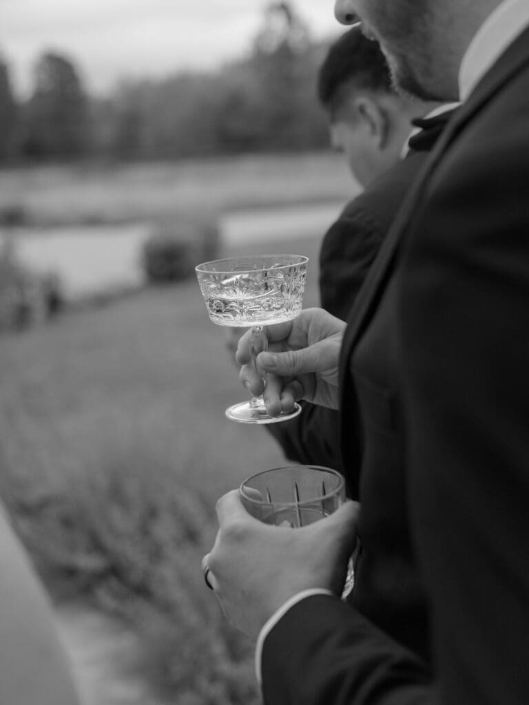 Wedding guests enjoying cocktails outdoors during a Greystone Castle wedding